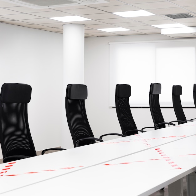 Empty conference room with black chairs