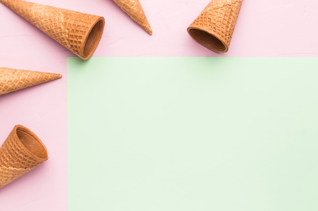 Free Photo empty crispy ice cream cones on multicolored surface