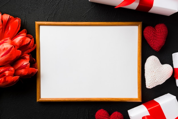 Free photo empty frame and valentine's day stuff