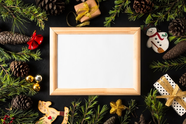 Free photo empty frame with festive christmas ornaments