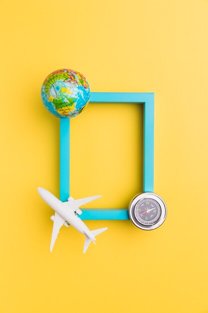 Empty frame with plane and globe