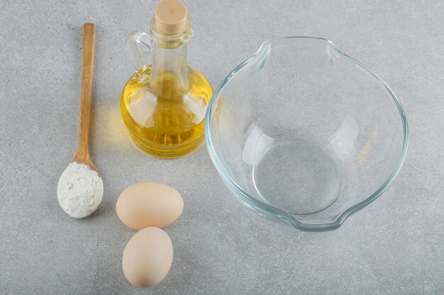 An empty glass plate with fresh chicken fresh eggs .