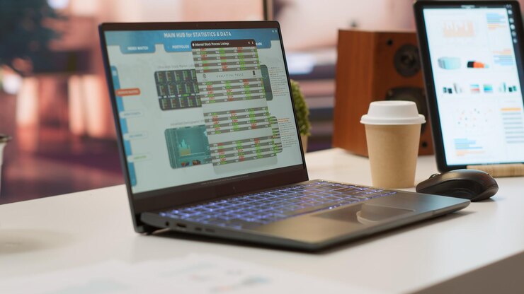 Free Photo empty home office with tablet and laptop shows infographics and accounting data