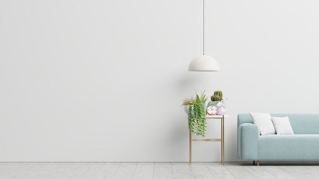 Empty living room with blue sofa, plants and table on empty white wall background. 3d rendering