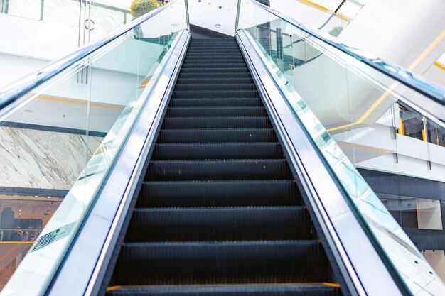 An empty modern escalator in a building