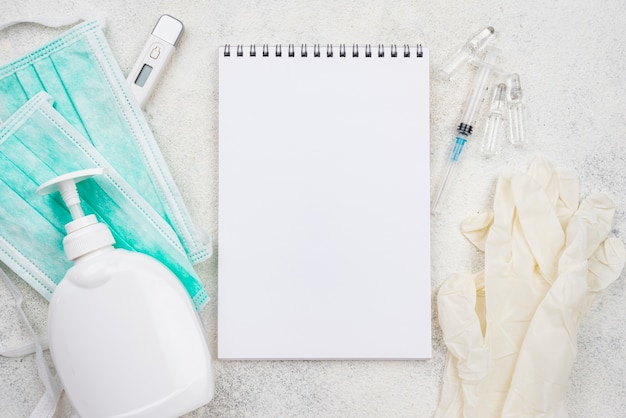 Free photo empty notepad on medical desk assortment