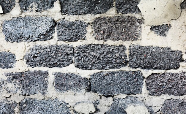 Empty old grey brick wall texture