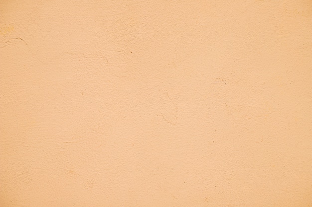 Empty orange painted textured wall