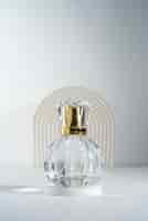 Free photo empty perfume bottle with golden details