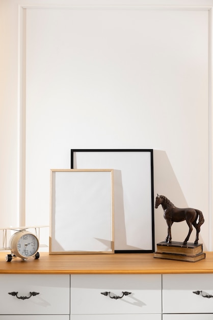 Empty photo frames on cabinet interior design