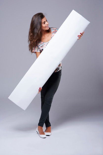 Empty placard held by a young woman