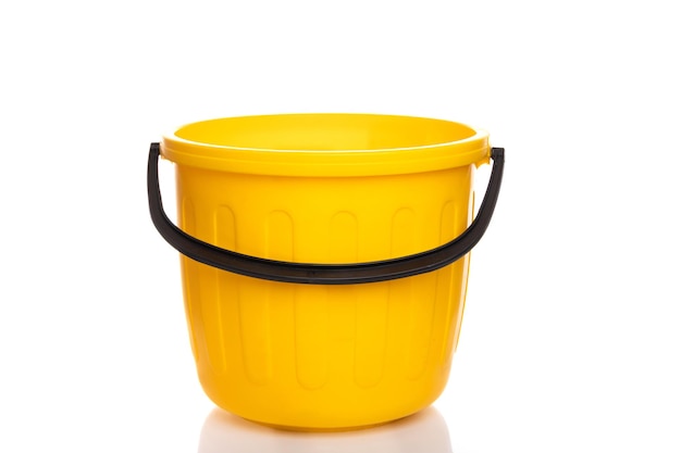 Empty plastic yellow bucket on white isolated background