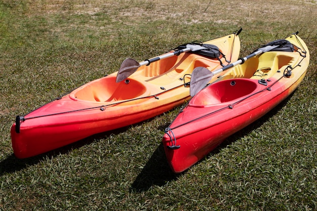 Free photo empty rowing boats in grass