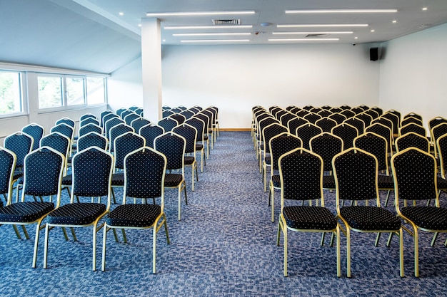 Empty seats in a row at convention center