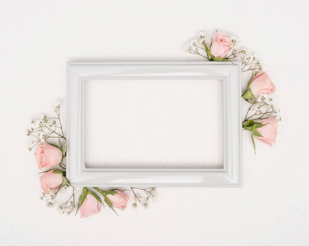 Empty vintage frame with roses buds