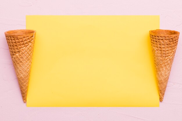 Empty waffle cones on different color background