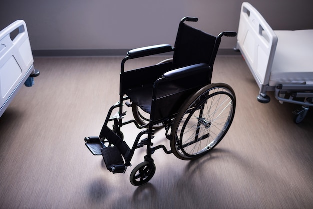 Empty wheelchair in ward