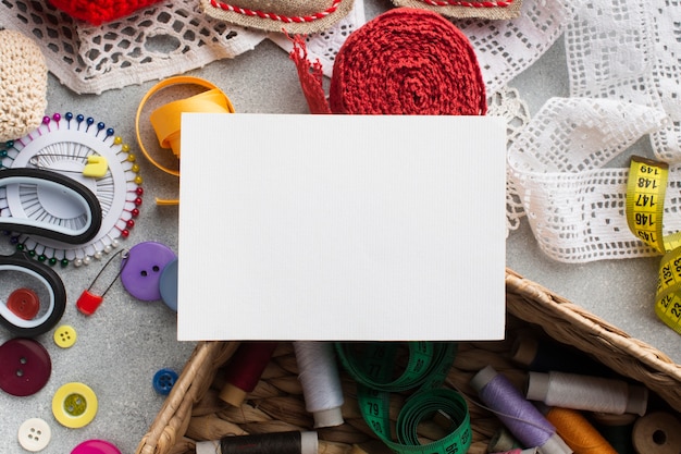 Empty white card and haberdashery colourful accessories