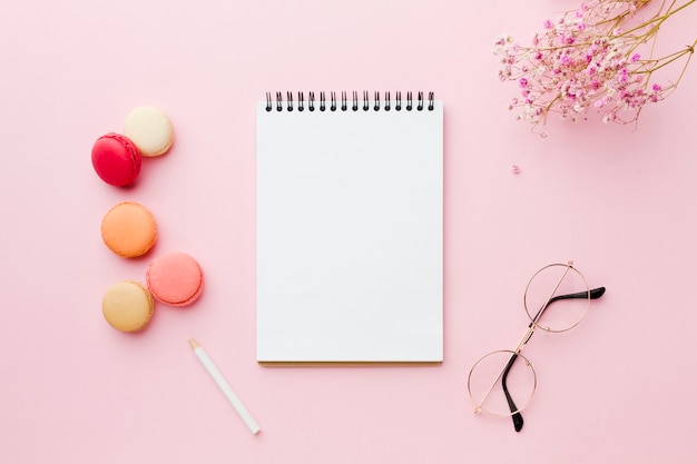 Empty white notepad and glasses top view