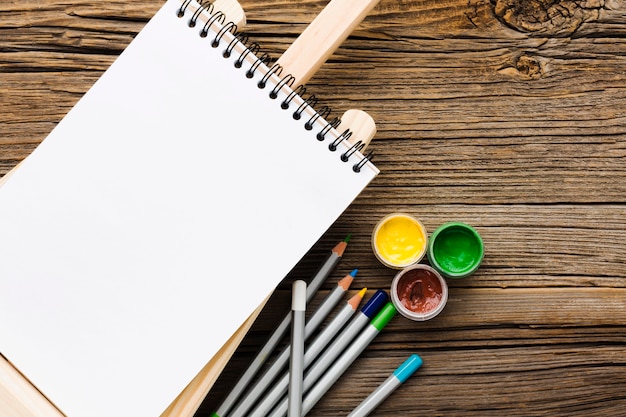 Empty white notepad and pencils