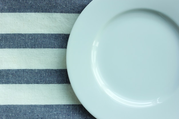 empty white plate with tablecloth