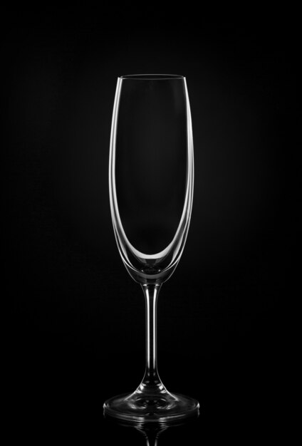 Empty wine glass on dark wall