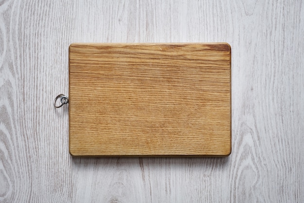 Empty wooden cutting board top view