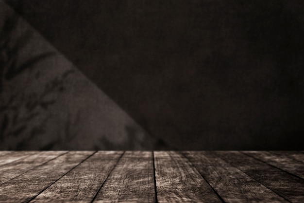 Empty wooden floor with black wall in loft style