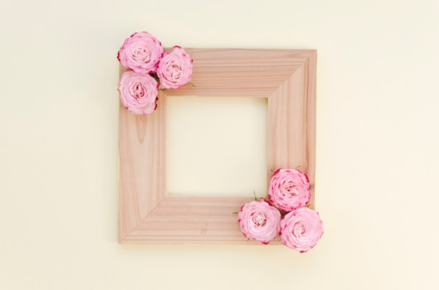 Empty wooden frame with roses