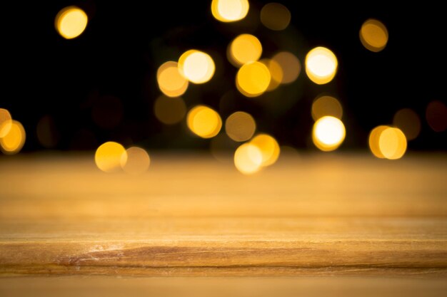 Empty wooden table. christmas sparkles on background. design for your product, new year decoration image