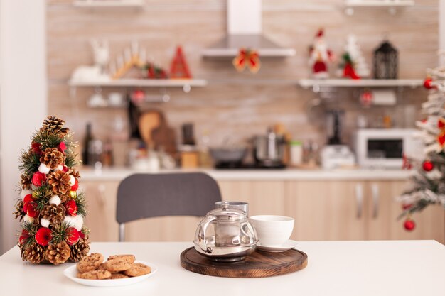 Empty xmas decorated culinary kitchen with nobody in it ready for christmas holiday