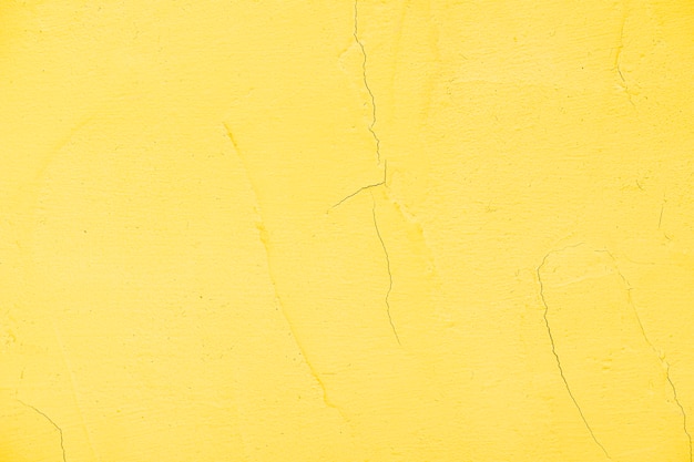 Empty yellow painted textured wall
