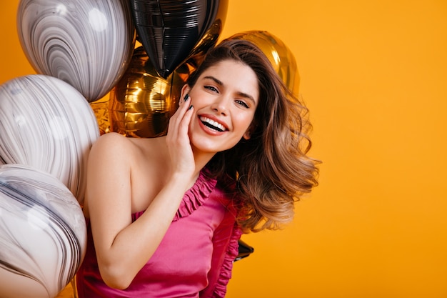 Free photo enchanting woman smiling at party