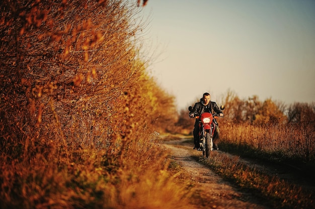 Enduro racer sitting on his motorcycle