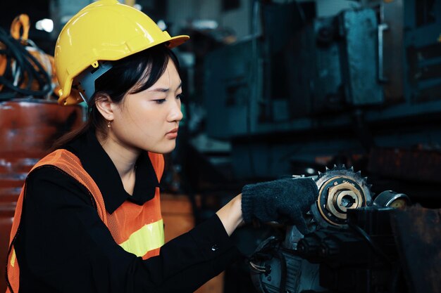 Engineering woman fixing machine in warehouse