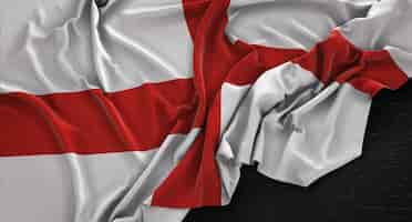 Free photo england flag wrinkled on dark background 3d render