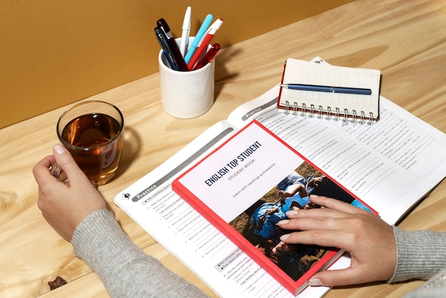 Free photo english book resting on the table of working space