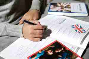 Free photo english book resting on the table of working space