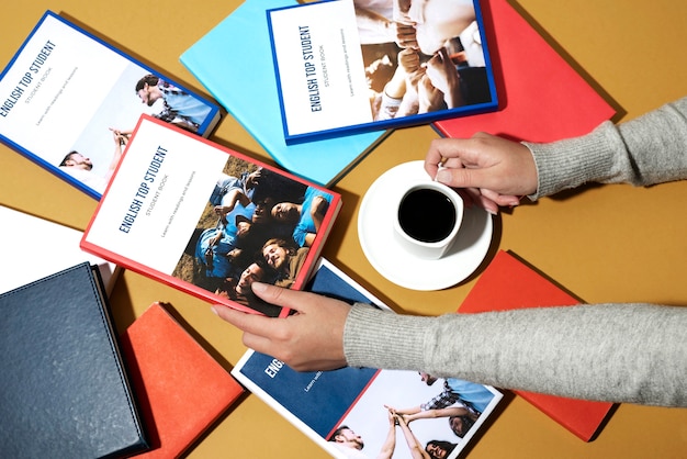 Free photo english book resting on the table of working space