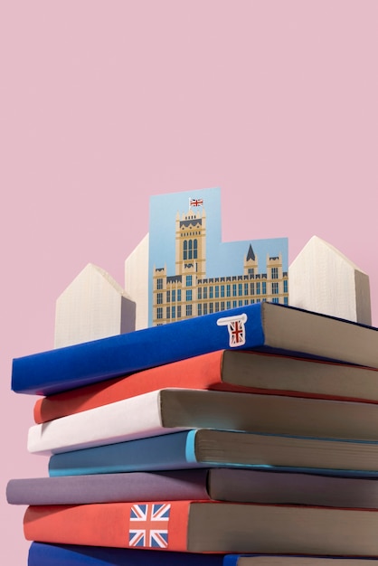 English books stacks on table of working space