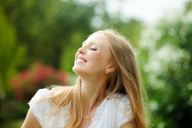 enjoying blonde long-haired woman