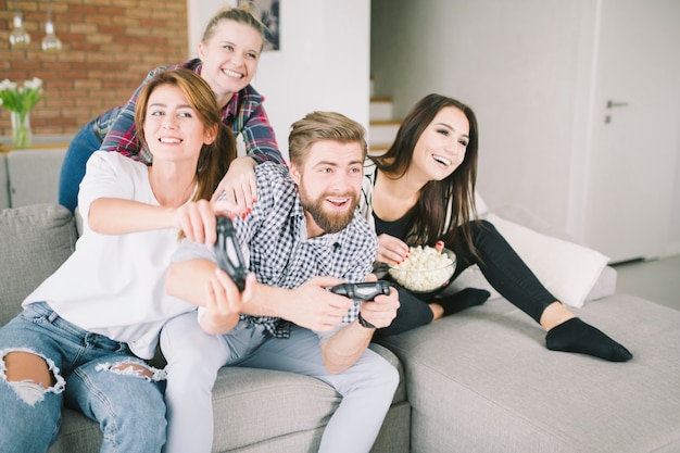 Entertaining friends playing game in group 