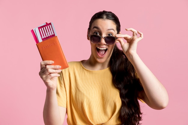 Free photo enthusiast woman holding her passport