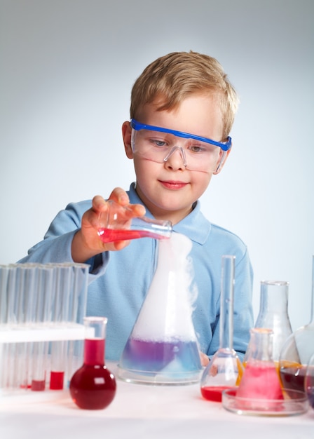 Enthusiastic schoolboy with his experiment