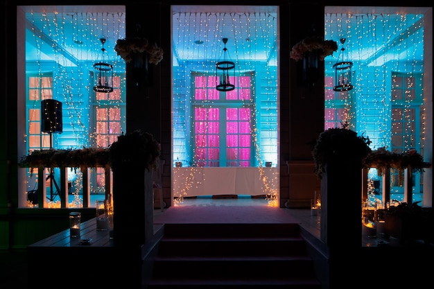 Entrance to the house and porch shine in the darkness