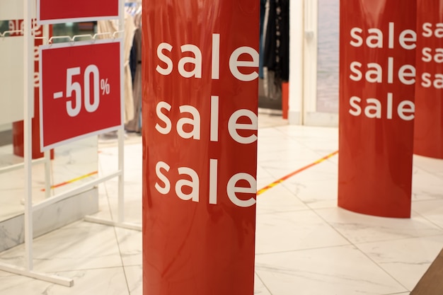 Entrance lobby to store, decorated for seasons of discounts, 50% off discount, with inscription sales. fashion concept, discount season, black friday, offline shopping, gimmicks, holiday sales.