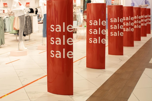 Entrance lobby to store, decorated for seasons of discounts, with inscription sales. fashion concept, discount season, black friday, offline shopping, gimmicks, holiday sales.