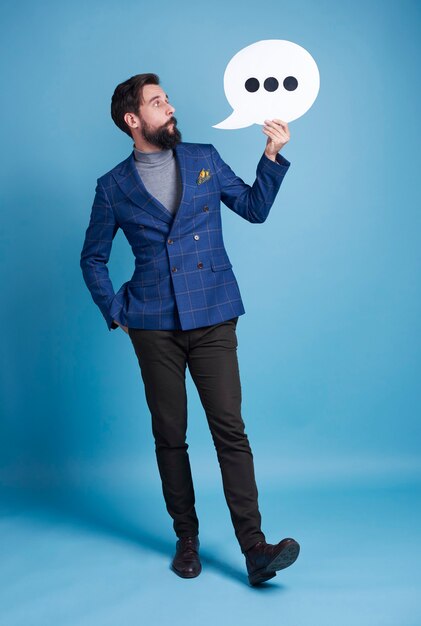 Entrepreneur holding speech bubble 