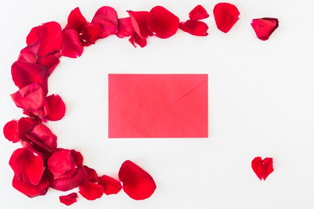 Envelope near set of red flower petals