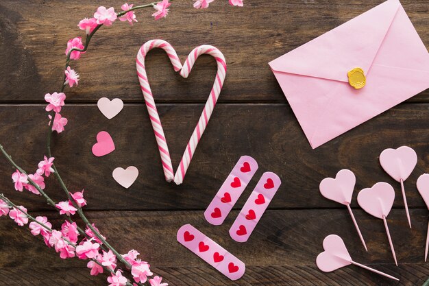 Envelope near twigs with flowers and candy canes